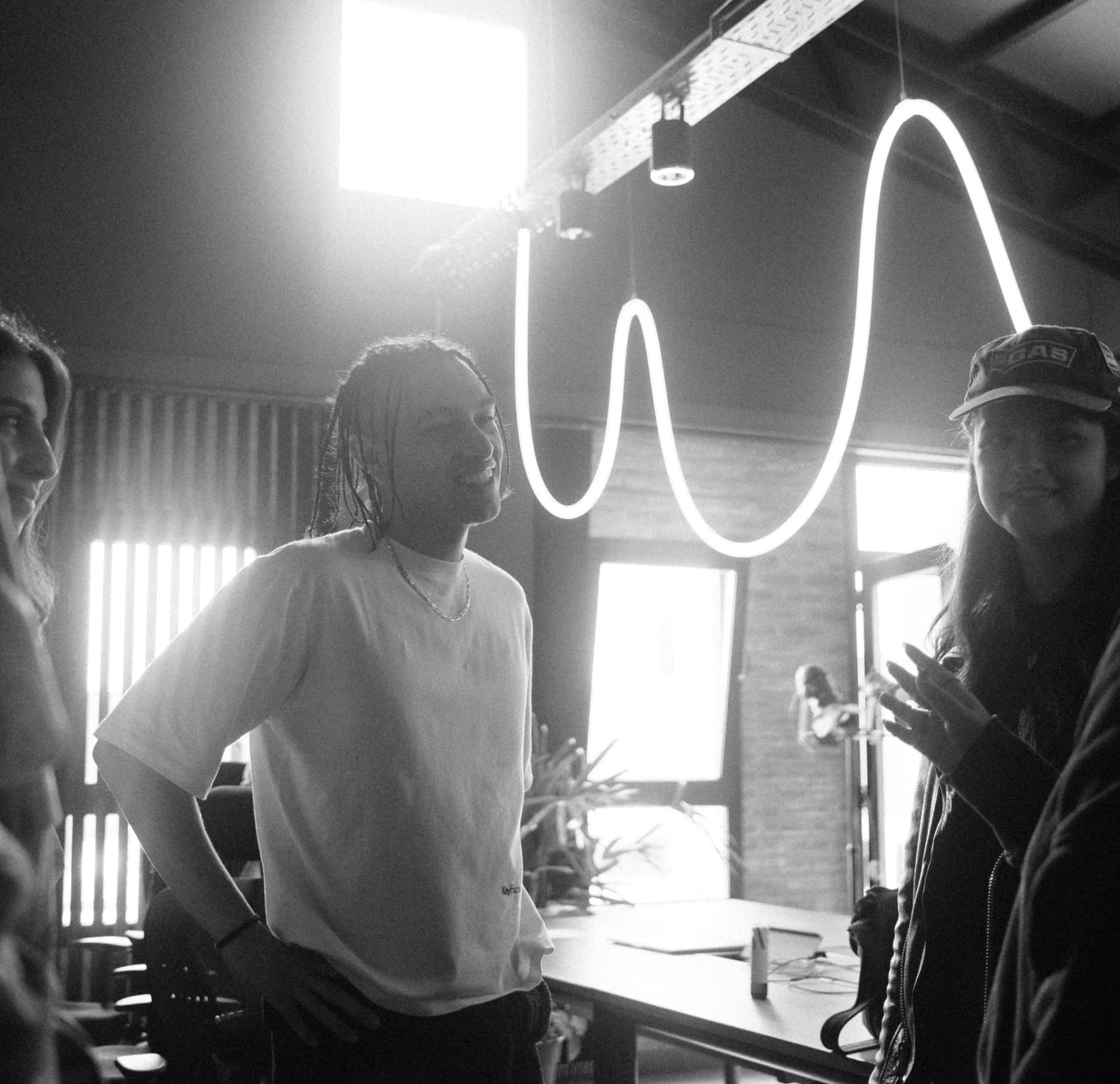 A group of people standing around a room